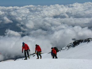 tourist walking on top of mount Kilimanjaro